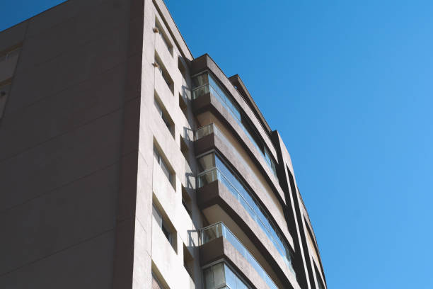 istock Modern Building Facade with Curved Balconies and Blue Sky 2169270357