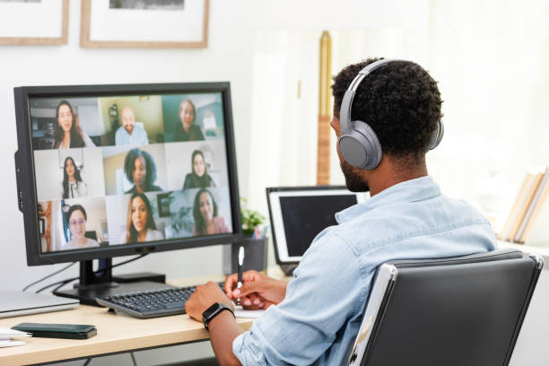 istock Young businessman attends virtual meeting with team 2169270895