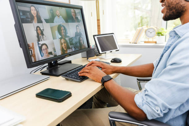 istock During video meeting, young man privately chats with co-worker 2169270918