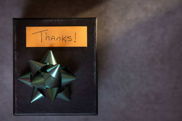 A box with a bow on top and a note that says \
