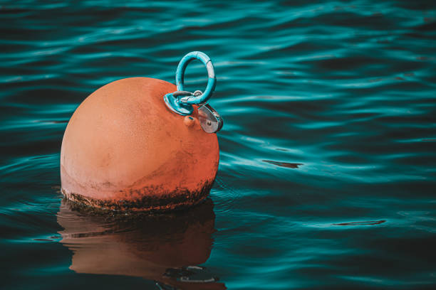 A lone buoy in dark blue waters in Norway