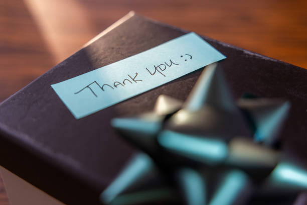 A box with a bow on top and a note that says \