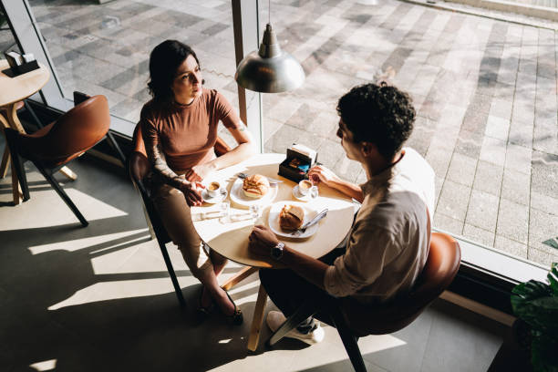 istock Young couple talking on a coffee shop 2169272945