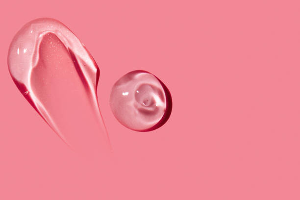 istock smear of clear gel on pink background with empty space. 2169275993