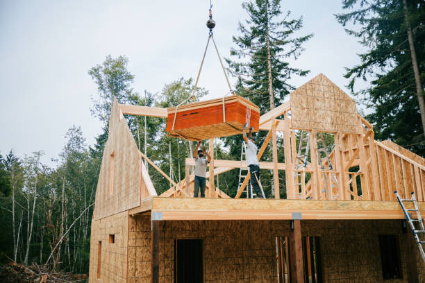 istock Construction Crew Putting Up Framing of New Home 2169277183