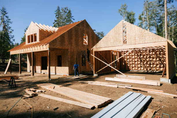 istock Construction Crew Putting Up Framing of New Home 2169277299