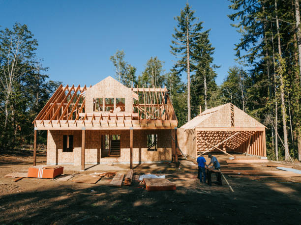 Construction Crew Putting Up Framing of New Home