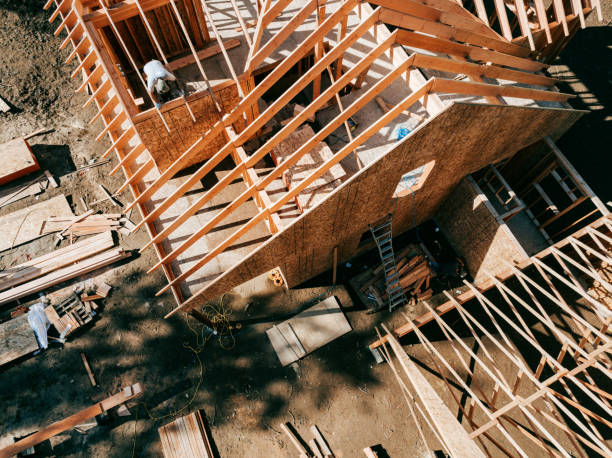 Construction Crew Putting Up Framing of New Home