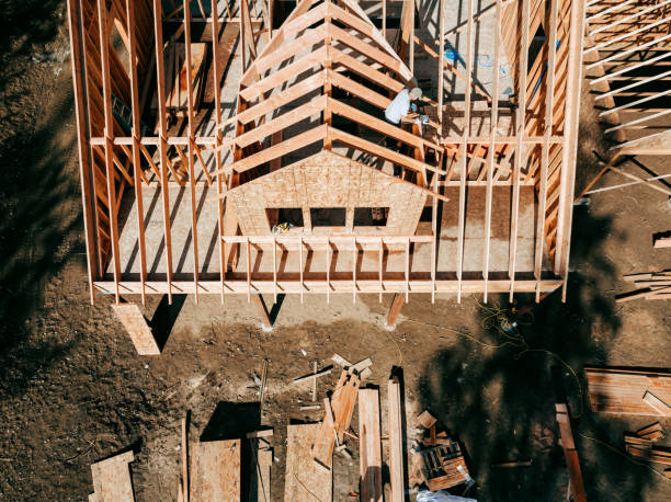 istock Construction Crew Putting Up Framing of New Home 2169277974