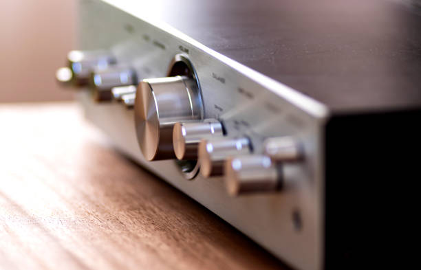 Vintage Audio Stereo Gear - Amplifier Metal Front Panel with Large Volume Control Knob and other Controls, Angled View Closeup