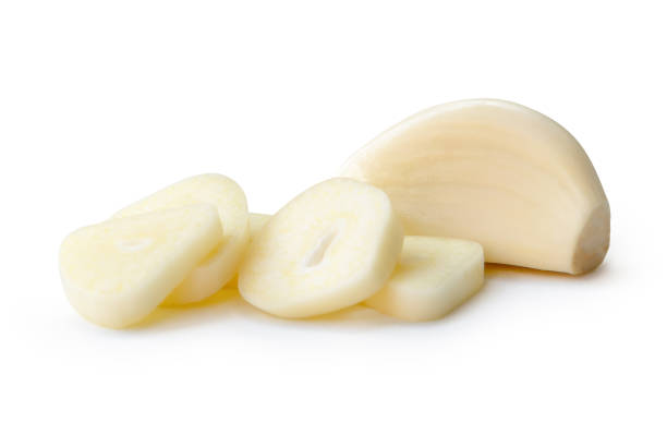 istock Fresh peeled garlic clove with slices or pieces in stack isolated on white background with clipping path 2169283578