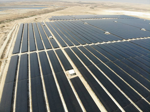 istock Solar panels power station desert aerial view 2169284090