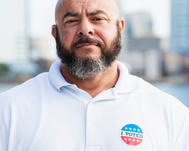 istock Mature man with I Voted sticker on shirt 2169286711