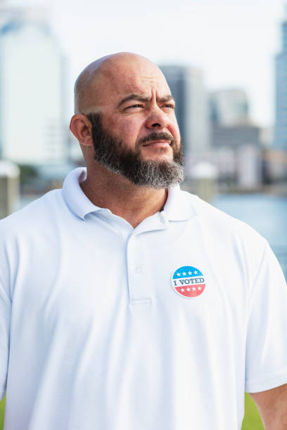 istock Mature man with I Voted sticker on shirt 2169286712