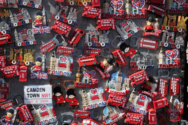 London UK 08 28 2024 Souvenir fridge magnets with red London buses, telephone boxes, or famous landmarks. One trinket says Camden Town the popular tourist destination.