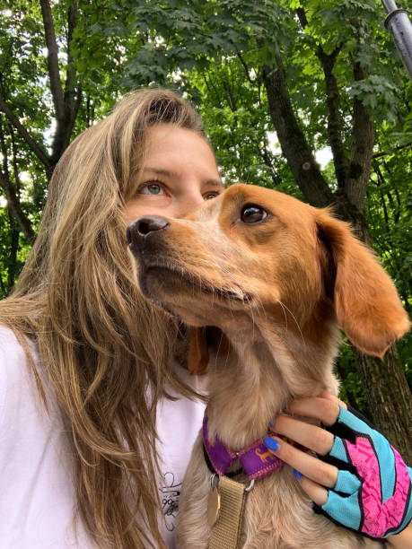 istock A women hugging her dog. Bonding with a dog. 2169292221