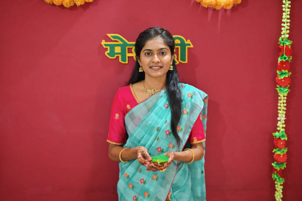 Portrait of Bride-to-Be Holding Beetle Nut Leaf and Beetle Nut for Bangle Wearing Ceremony