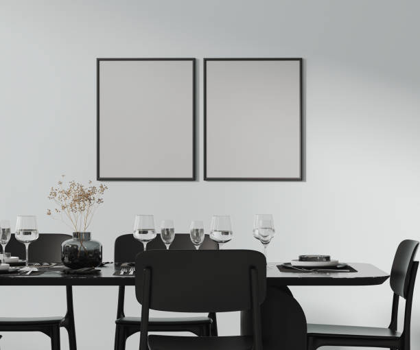 istock two frames mock up above a beautiful dining table setted with cutlery, plates, glasses and decor, black furniture , 3d rendering 2169293679