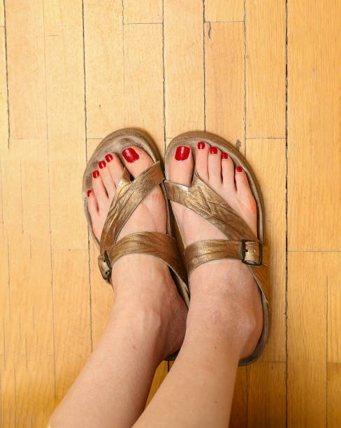 istock Red tne nails in sandals 2169294164
