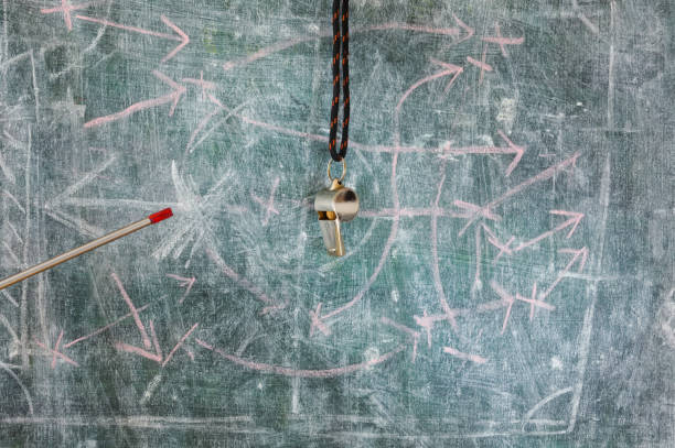 istock soccer tactics scribble on blackboard pointer stick and whistle of soccer referee or trainer. Great soccer event this year, soccer championship concept. 2169297590