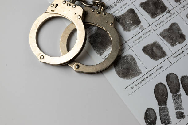 istock Handcuffs and fingerprint card 2169307211