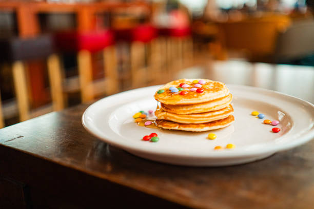 Close up of group of baked pancakes on a plate.
