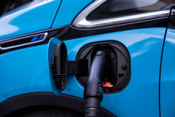 istock Charging a Modern Blue Electric Vehicle at Public Charging Station 2169321896