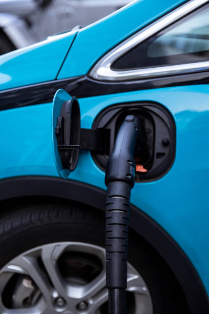 istock Charging a Modern Blue Electric Vehicle at Public Charging Station 2169321906