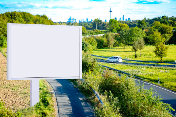 blank billboard on with copy space for text or content, mockup blank billboard, road with green trees, bird's-eye view, multi-lane highway with car traffic, Space for your ad