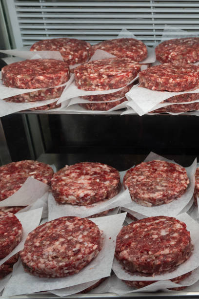 istock Stacked Hamburger patties in a Butcher Shop 2169325811