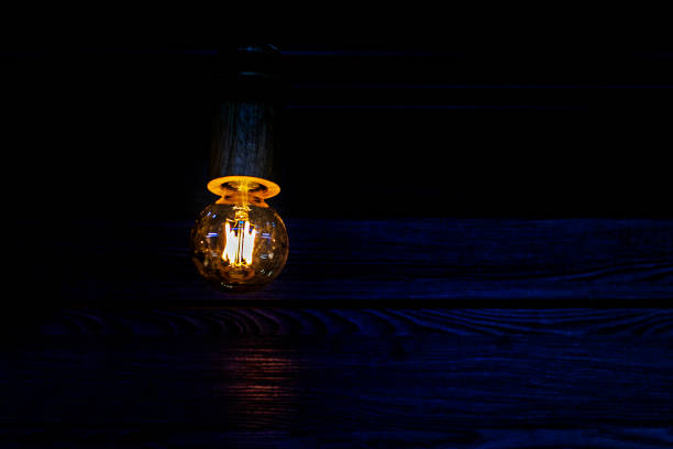 istock glowing light bulb from an inverter or generator. energy crisis blackout 2169341667