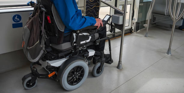istock Man on electric wheelchair on train 2169345526