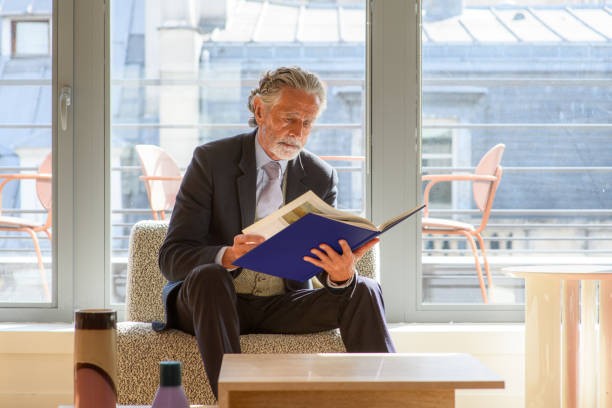 istock A senior businessman consults a file 2169348509