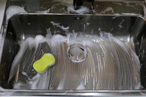 istock Cleaning the kitchen sink concept 2169348547