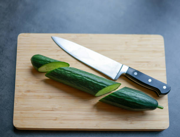 istock Cucumber cut in  on a cutting board 2169351820