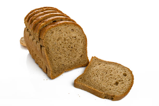 istock Sliced crusty whole grain bread isolated on white 2169352045