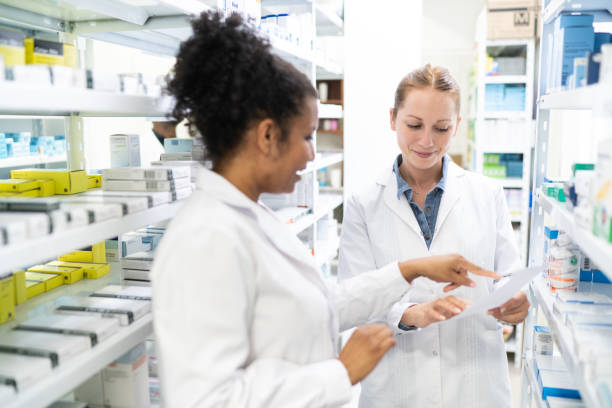 istock Pharmacist searching for medicine in storage room 2169352046