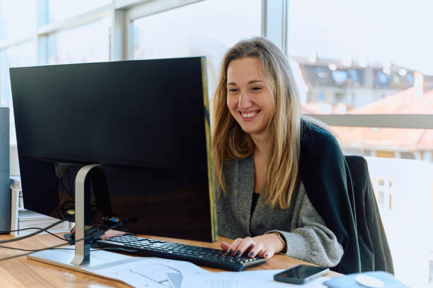 istock Businesswoman Programming a Product Design for Wood Processing Machine in Modern Office 2169358732