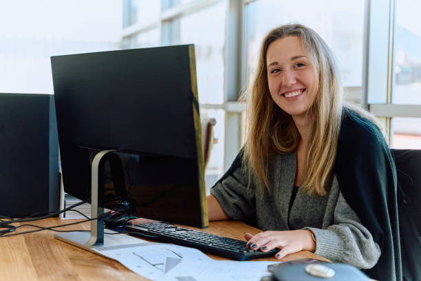 istock Businesswoman Programming a Product Design for Wood Processing Machine in Modern Office 2169358827