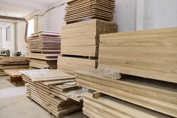 istock Wooden Parts and Boards Stored in Warehouse Ready for CNC Machine Processing 2169359149