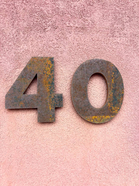 istock Rusty Number 40 Street Address on Pink Wall 2169360459