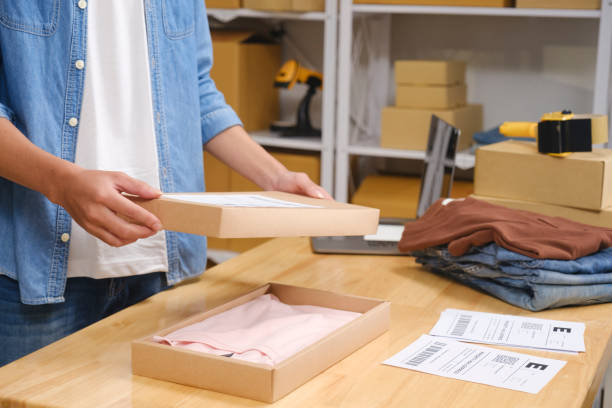 istock Young business owner working and selling online product and prepare packaging process at office for the order of customer. Online small business concept. 2169363021