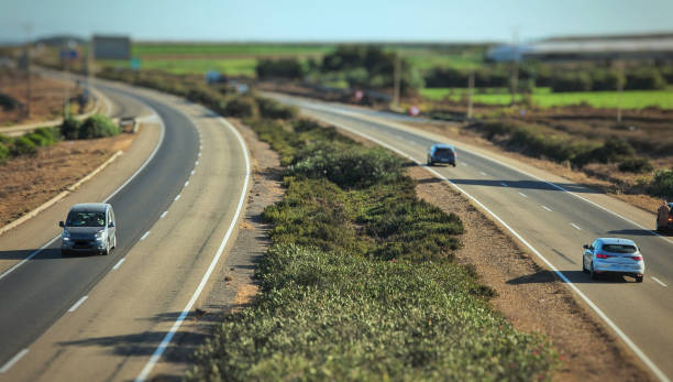 istock high angle view of cars moving fast on highway 2169363765