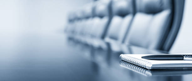 istock Notepad on a table with pen before meeting, blue tone, business concept with copy space 2169364916