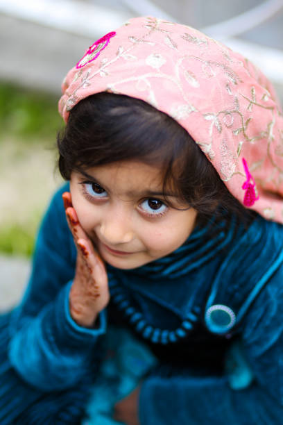 Muslim woman and young Asian Muslim girl praying in the mosque. of Ayutthaya Province, Thailand