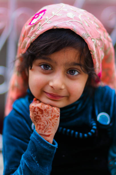 A Cute Pashtun Girl in Home Giving Some Poses To Her Father. Indoor Natural Light shots.