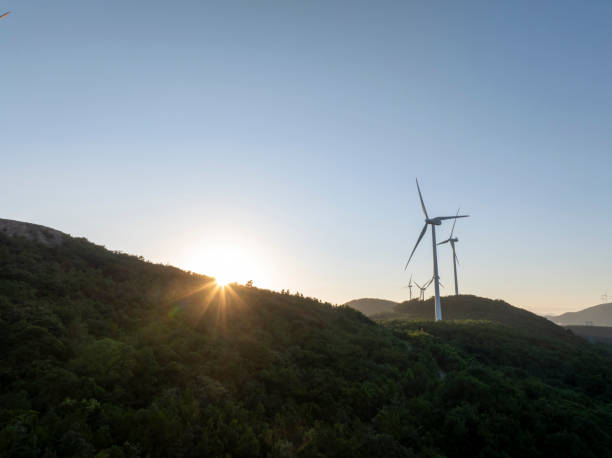 Free Stock Photo of Sunset over rolling hills with wind turbines ...