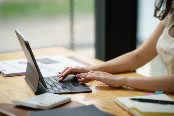 istock Closed_up hand typing on the keyboard of a digital tablet. 2169369395