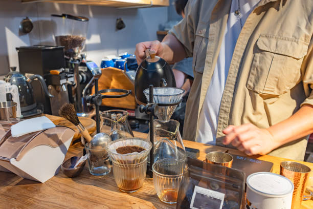 istock The man brewing hand ground coffee 2169373579