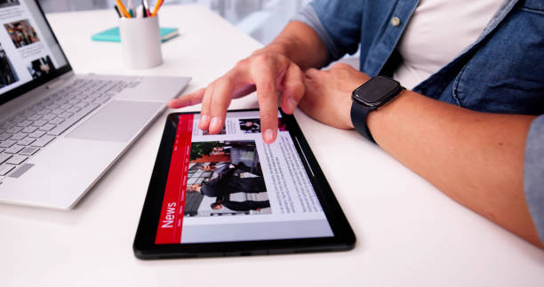 istock Watching News Online,Reading Digital Newspaper 2169373914